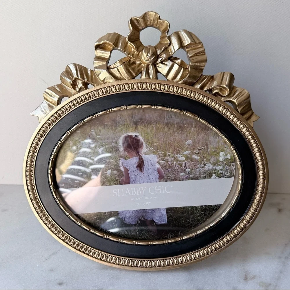 Ornate Oval Gold Photo Frame with Black Trim bow on top 7”x5”